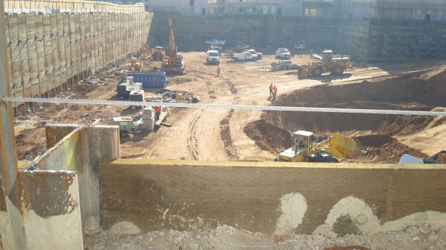 Workers preparing the foundation for the Columbia Square project.
