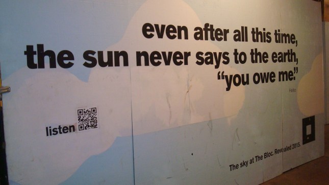 Construction barrier with a quote from Hafiz.