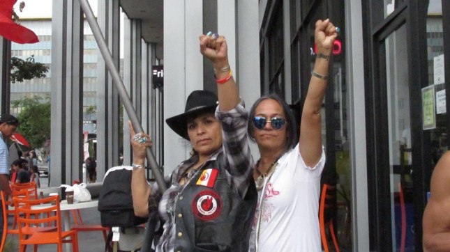 Lydia Ponce, of AIM SoCal, (right) posing with her sister.